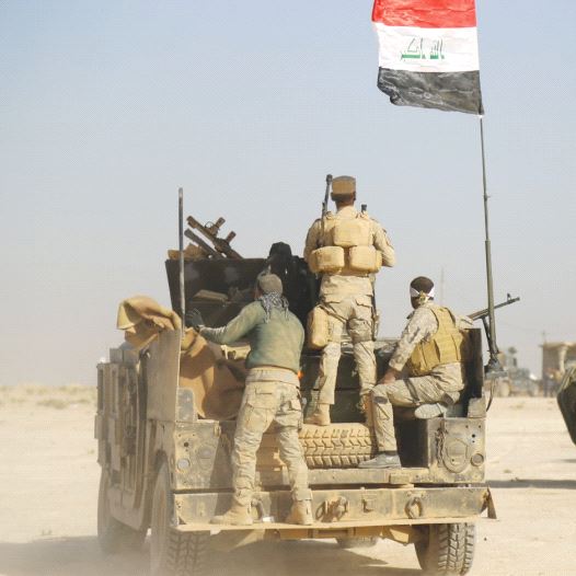 IRAQI FORCES advance in Qayara to attack Islamic State in Mosul yesterday.