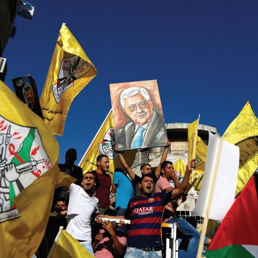 PALESTINIANS PARTICIPATE in a recent rally to support Palestinian President Mahmoud Abbas in Ramalla