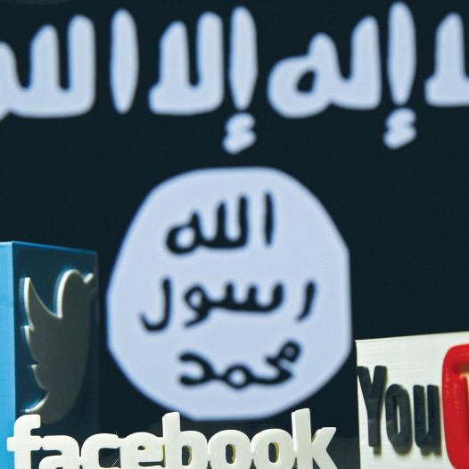 A 3-D PLASTIC representation of the Twitter, Facebook and YouTube logos is displayed in front an Isi