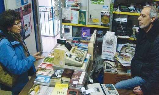 Uri Rucham serves a customer
