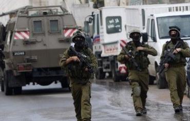 IDF soldiers patrol during a raid [file]