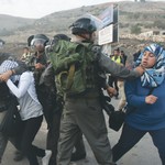 BORDER POLICE detain a Palestinian stonethrower