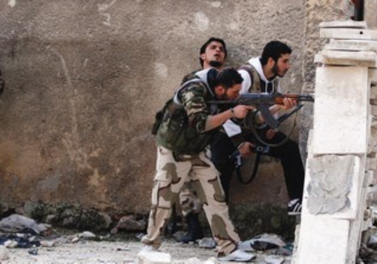 MEMBERS OF A Syrian opposition group are seen on the front lines in Aleppo