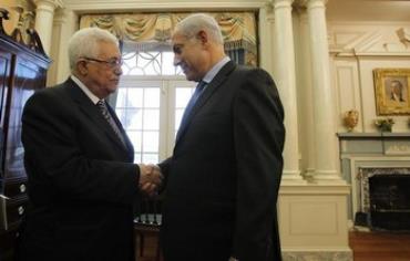 Prime Minister Benjamin Netanyahu (R) greets Palestinian President Mahmoud Abbas