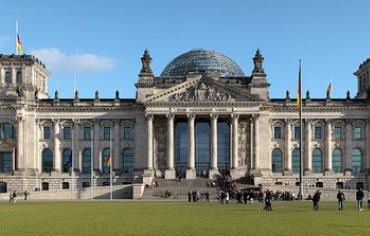 The Reichstag building seen from the west. Inscription translates to "For/To the German People"
