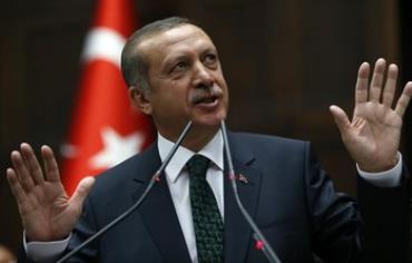 Turkey's Prime Minister Tayyip Erdogan addresses members of parliament from his ruling AK Party 