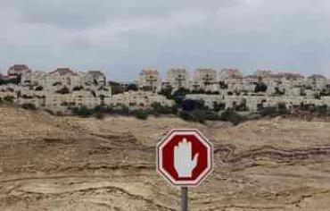 A stop sign is seen outside a West Bank Jewish settlement