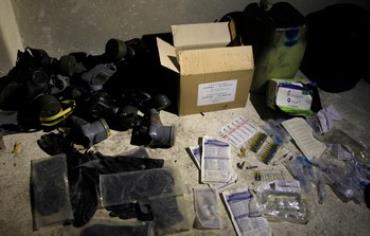 Chemical materials and gas masks are pictured in a warehouse at the front line of clashes in Syria.