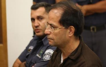 Suspected Iranian spy Ali Mansouri attends a remand hearing in a Petah Tikva court, Sept. 30, 2013. 