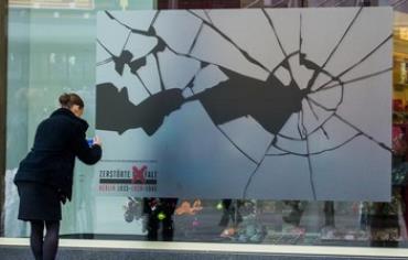 A sticker simulating broken glass on a shop window in Berlin to mark 'Kristallnacht' anniversary