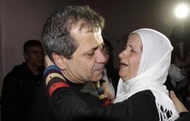 Moayyad Hajji hugs his sister after his release from prison 