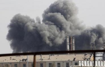 Smoke rises due to clashes in the Syrian town of Raqqa