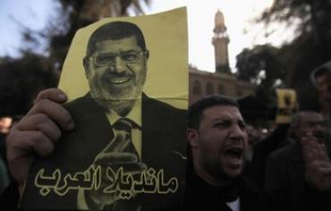 Supporters of the Muslim Brotherhood protest in Egypt, December 27, 2013.