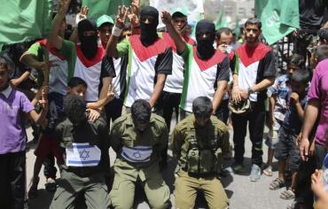 Hamas supporters reenact kidnapping of Israeli soldiers