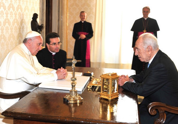 POPE FRANCIS and former president Shimon Peres chat at the Vatican yesterday.
