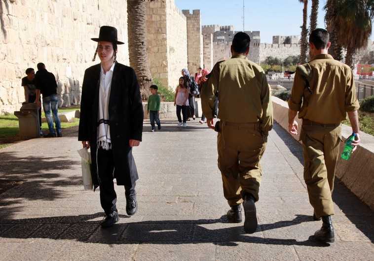 Haredi man and IDF soldiers in Jerusalem.