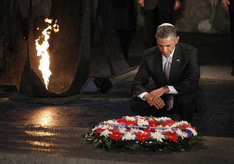 U.S. President Barack Obama pauses for a moment as he lays a wreath at Yad Vashem