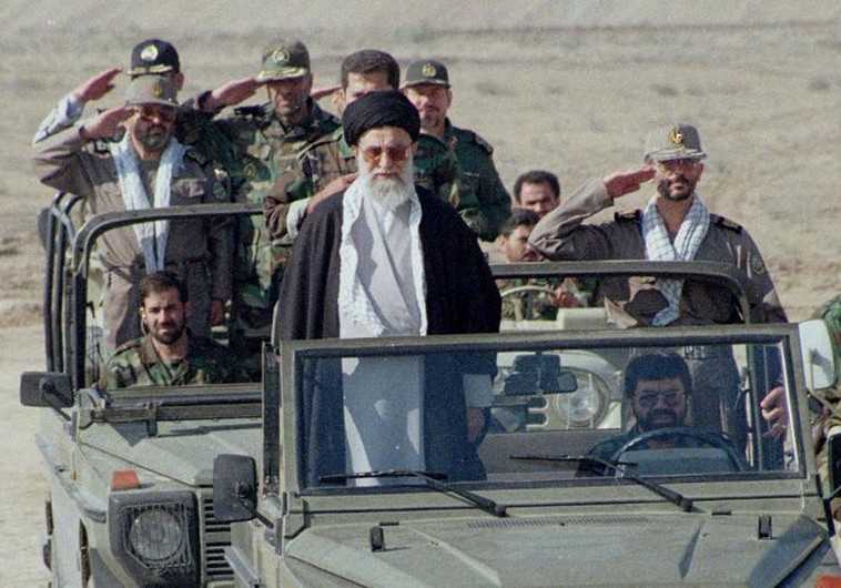 Iran's supreme leader, Ayatollah Ali Khamenei, stands in front of a jeep