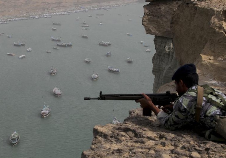 Iranian military personnel participate in war games in an unknown location near the Strait of Hormuz