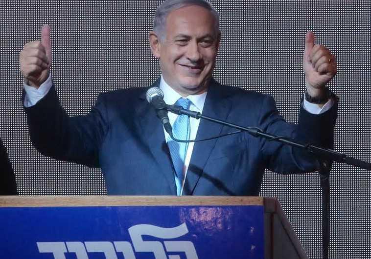 Prime Minister Benjamin Netanyahu gestures during his victory speech at Likud headquarters