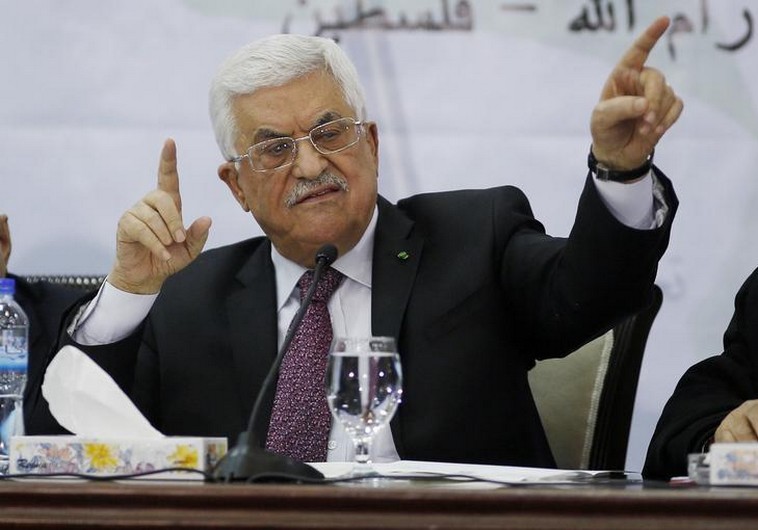 Palestinian Authority Chairman Mahmoud Abbas gestures as he speaks during a meeting in Ramallah