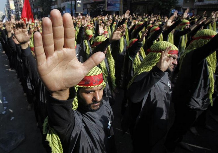 Lebanese Hezbollah supporters gesture as they march during a religious procession to mark Ashura