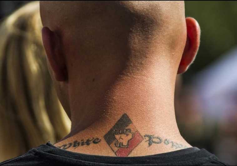 A white power tattoo is seen at a far-right wing summer festival in the German village of Viereck
