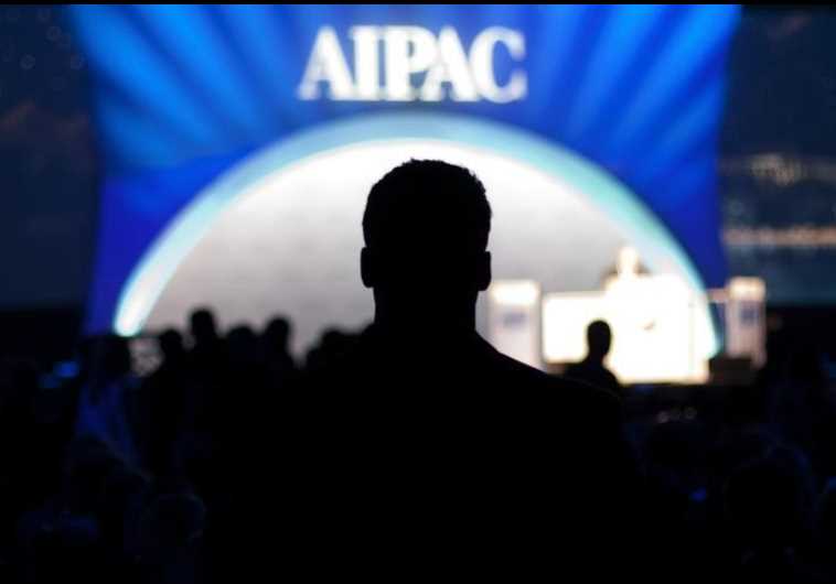 A man waits for the start of the evening's speeches at the American Israel Public Affairs Committee