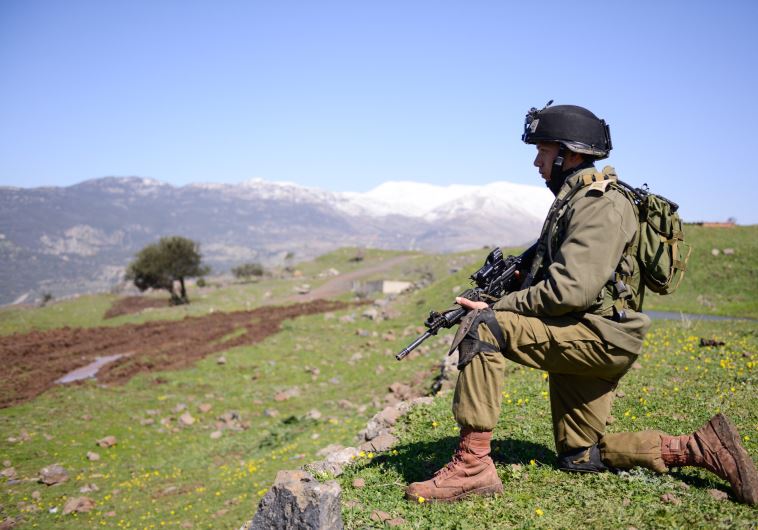 An IDF soldier takes part in drills on the Golan Heights