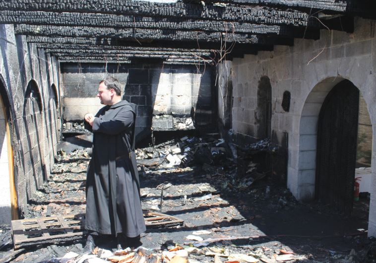 FATHER NIKODEMUS SCHNABEL inspects the damage at Capernaum’s Church of the Loaves and Fishes