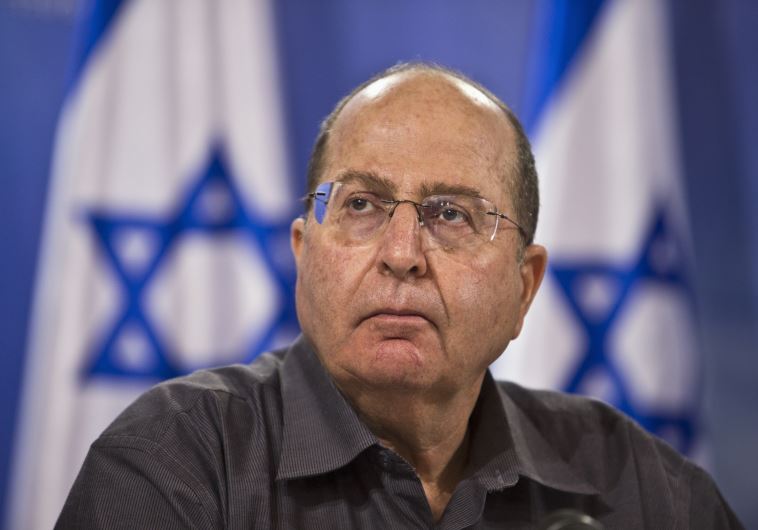 Defense Minister Moshe Yaalon attends a news conference in Tel Aviv