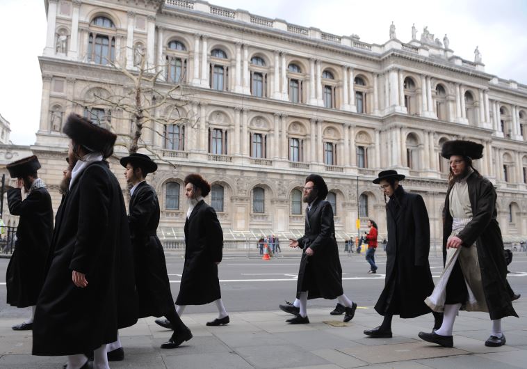 Orthodox Jews walk along Whitehall in central London