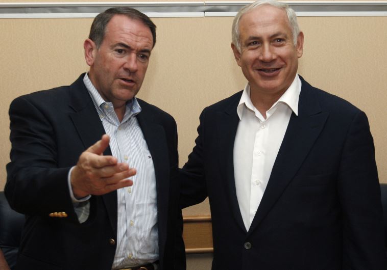 Former Arkansas Governor Mike Huckabee (L) meets Prime Minister Benjamin Netanyahu in Tel Aviv