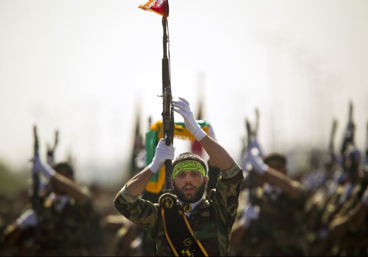Members of Iran's Basij militia march 