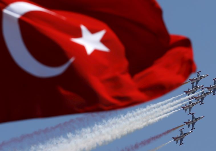 Turkish Stars, the aerobatic team of the Turkish Air Force, perform a maneuver 