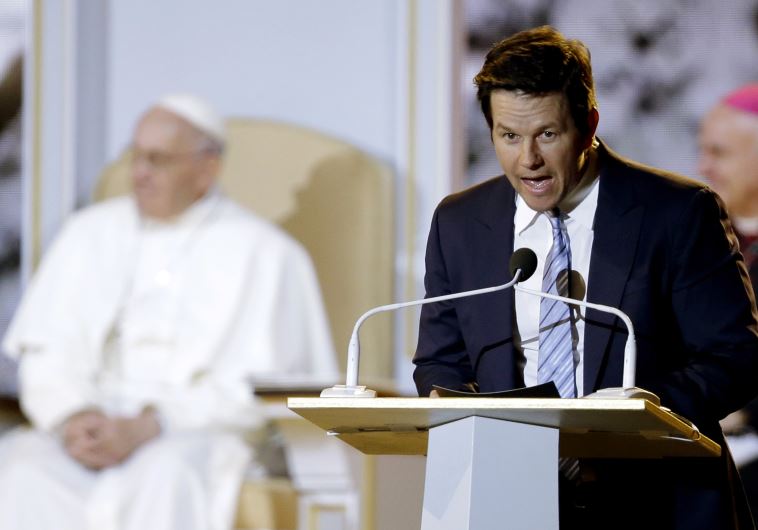 Pope Francis (L) listens to actor Mark Wahlberg speak at the Festival of Families in Philadelphia