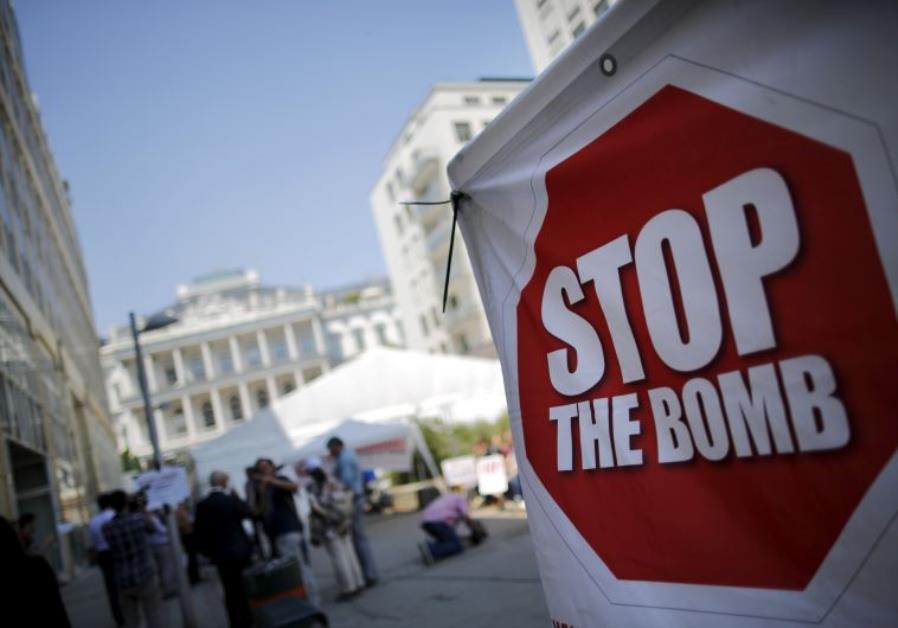 A sign which reads "Stop the Bomb" 