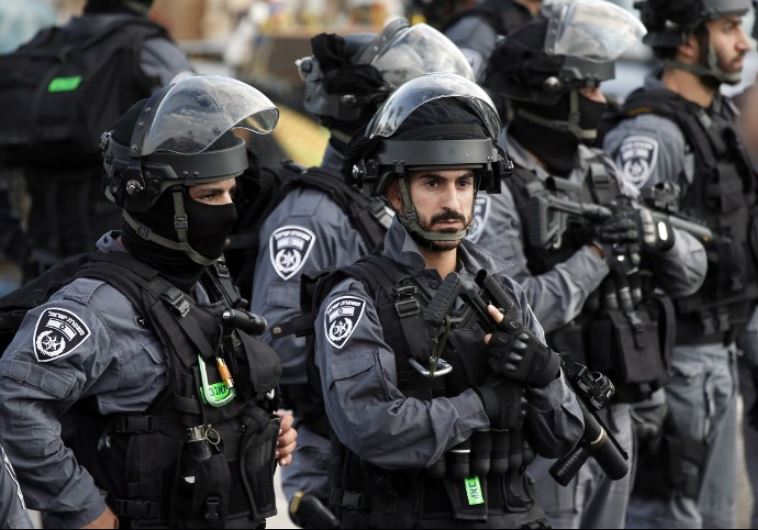 Israeli security forces stand guard in front of the Damascus Gate near the Old City of Jerusalem