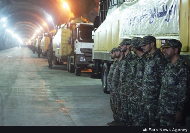SOLDIERS OF the Revolutionary Guards Corps stand at attention in an underground missile facility rec