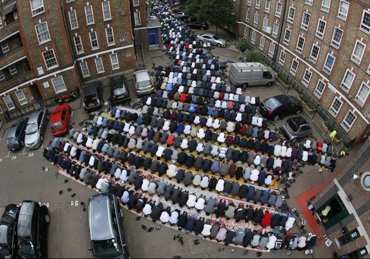 Muslims attend Friday prayers during the second day of Ramadan in east London