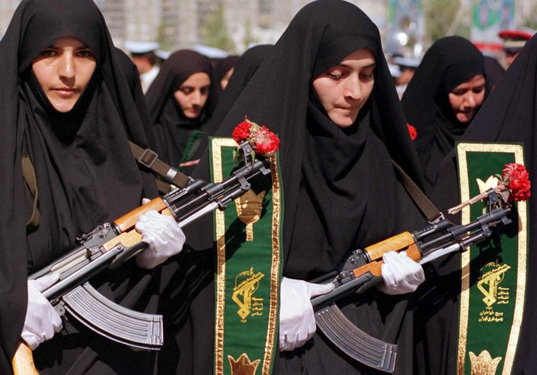 Iranian women mark the 20th anniversary of the start of the Iran-Iraq war during a military parade