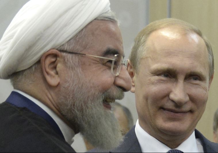 President Vladimir Putin (R) meets with Iran's President Hassan Rouhani in Ufa, Russia