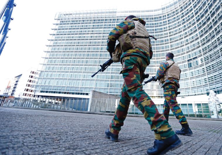 BELGIAN SOLDIERS patrol outside European Commission headquarters in Brussels