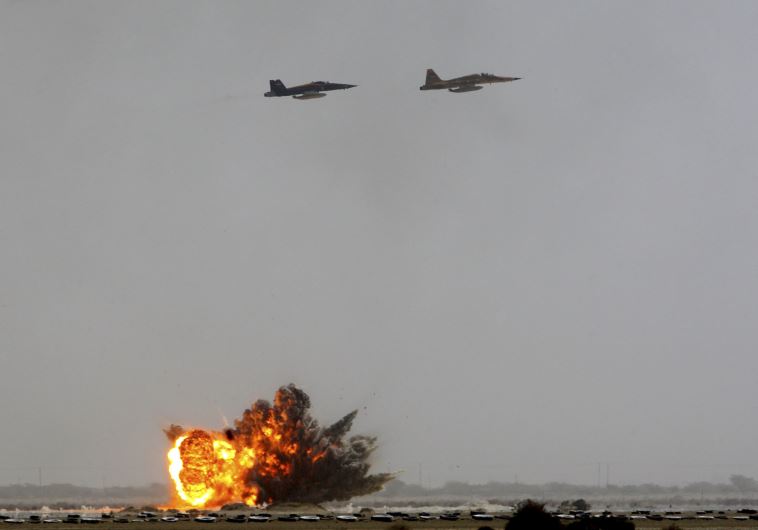 Iranian air force fighter planes drop bombs on targets during manoeuvres in southern Iran June 24, 2