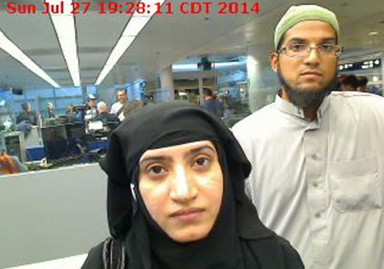 Tashfeen Malik, (L), and Syed Farook are pictured passing through Chicago's O'Hare Airport