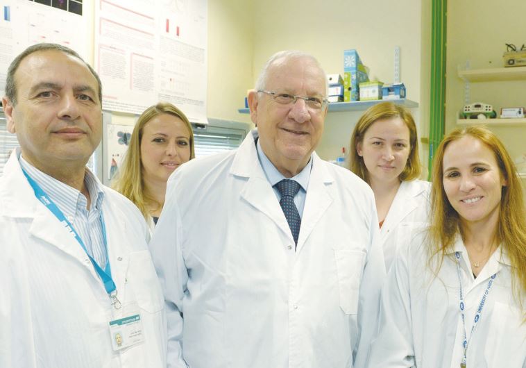 PRESIDENT REUVEN RIVLIN visits a molecular biology laboratory at the University of Haifa