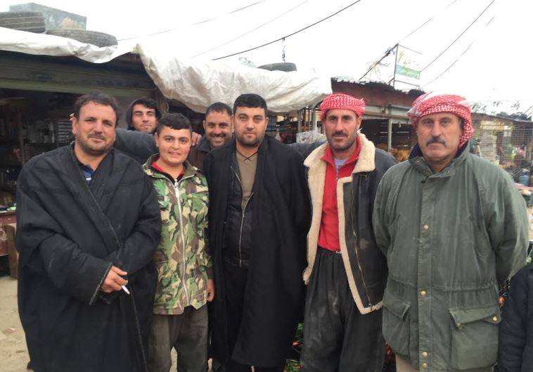 Yazidi men in Snune, one of the few villages some people returned to 