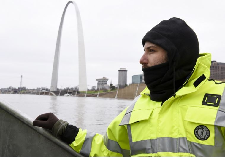 US Geological Survey (USGS) hydro technician Jason Carron assesses the Mississippi River flood water