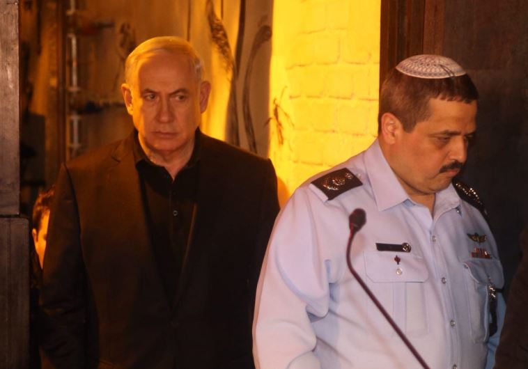 Prime Minister Benjamin Netanyahu visits the site of the shooting on Dizengoff, January 2. 2016.