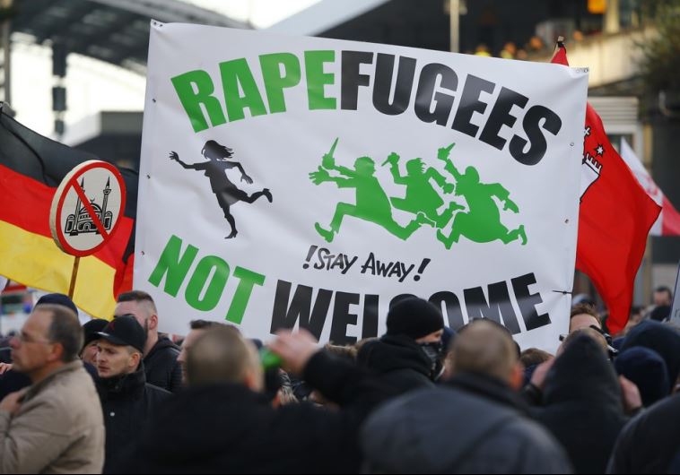 Supporters of anti-immigration right-wing movement PEGIDA rally in Cologne